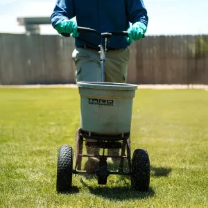 technician-fertilizing-lawn